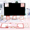 A set of strawberry shaped self-stick memo notes in various colors and patterns displayed on a desk.
