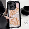 A black phone case with a croissant newspaper pattern featuring a pink ribbon and text.