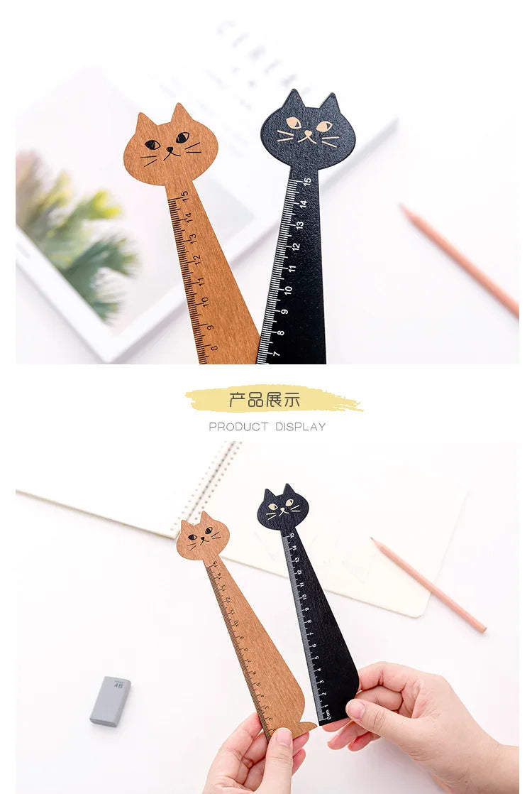 A set of cute cartoon cat wooden drawing rulers in natural wood and black, displayed on white paper.