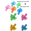 A collection of colorful silicone pencil grips including butterfly shapes in pink, orange, green, blue, and yellow.