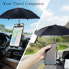 A hand holds a smartphone attached to an umbrella stand in a car, showing a map display.