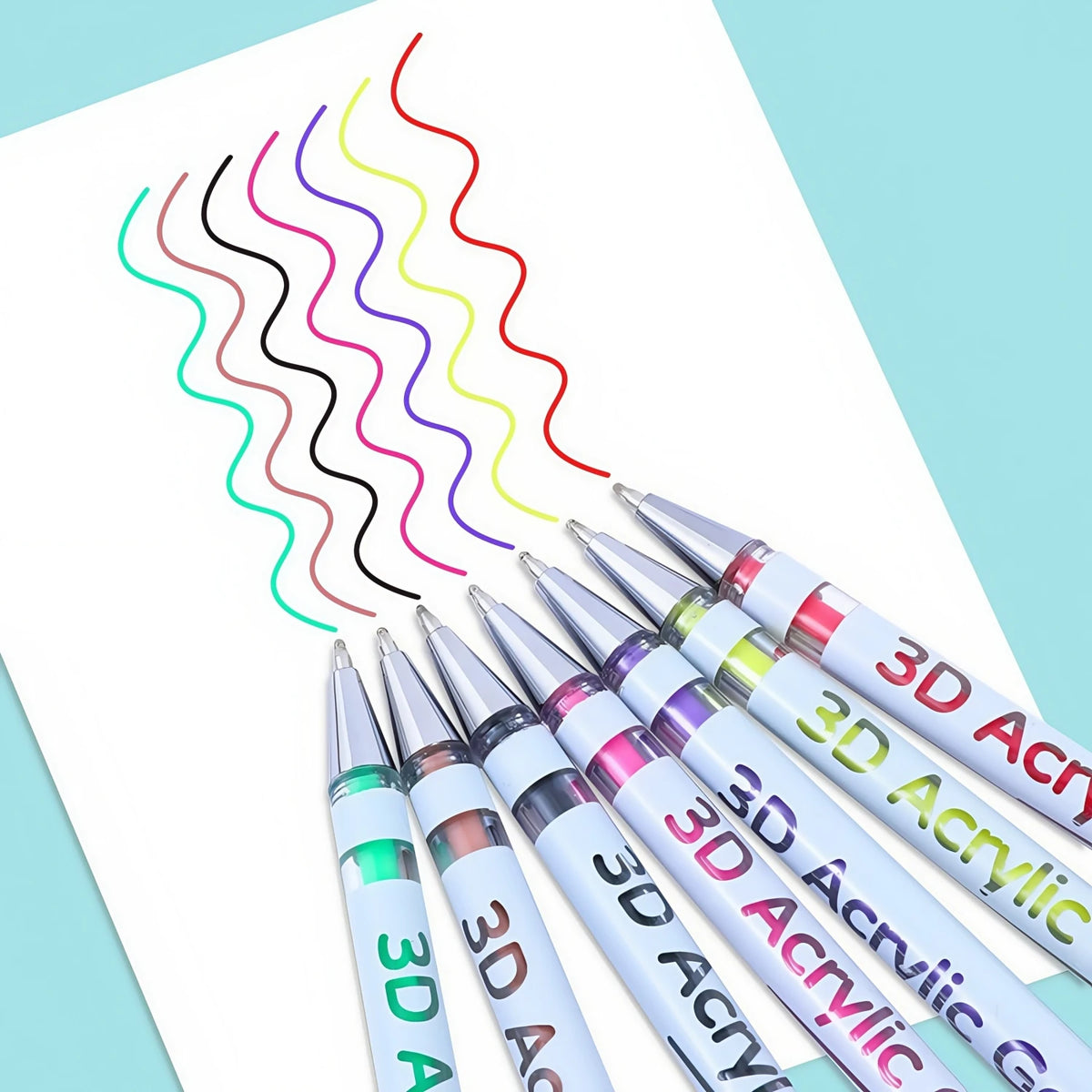 Un set de tres bolígrafos de gel acrílico con líneas onduladas de varios colores dibujadas en una hoja de papel blanca.