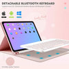 A pink iPad is shown with a white detachable Bluetooth keyboard resting on a matching anti-skid leather texture surface.