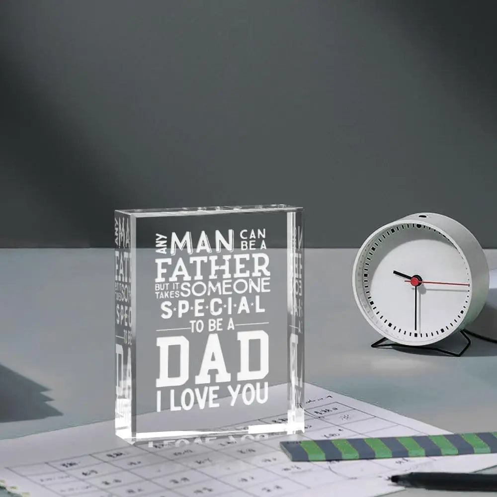 A clear glass keepsake box with engraved text that reads Any man can be a father but it someone special to be a dad I love yo