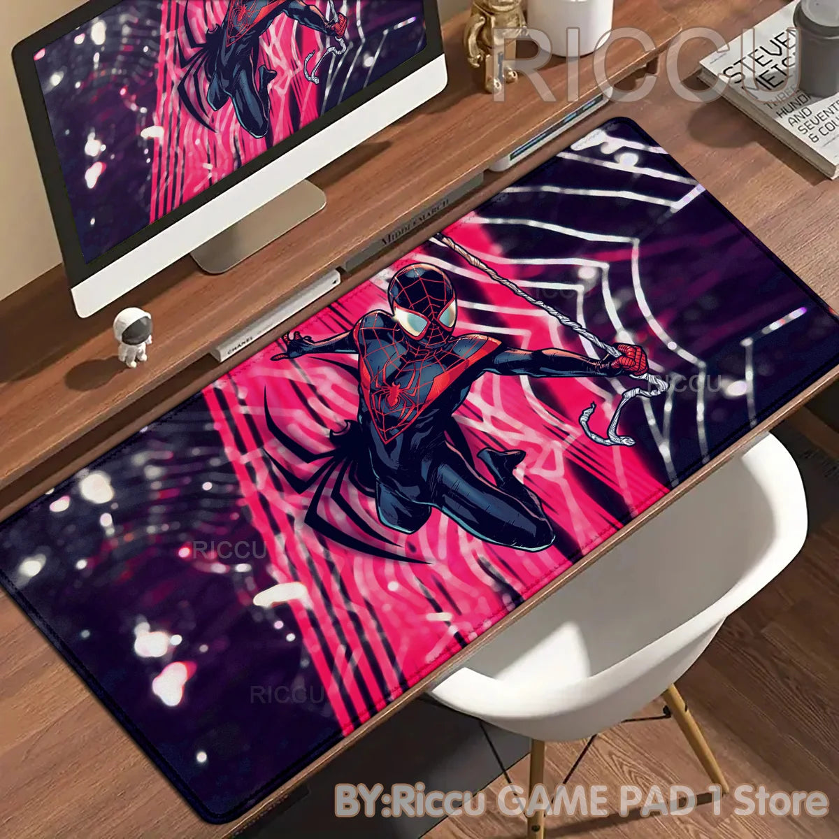 A vibrant Spider-Man anime desk mat featuring a superhero in a dynamic pose on a wooden desk.