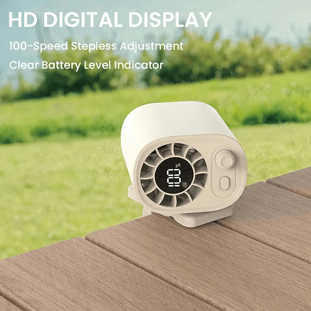 A white mini fan with a digital display and battery indicator is placed on a wooden surface outdoors.