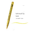 A gold metallic brush pen with a soft tip is shown next to a gold glitter line.