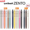 A row of UniBall ZENTO precision gel pens in various colors and sizes is displayed.