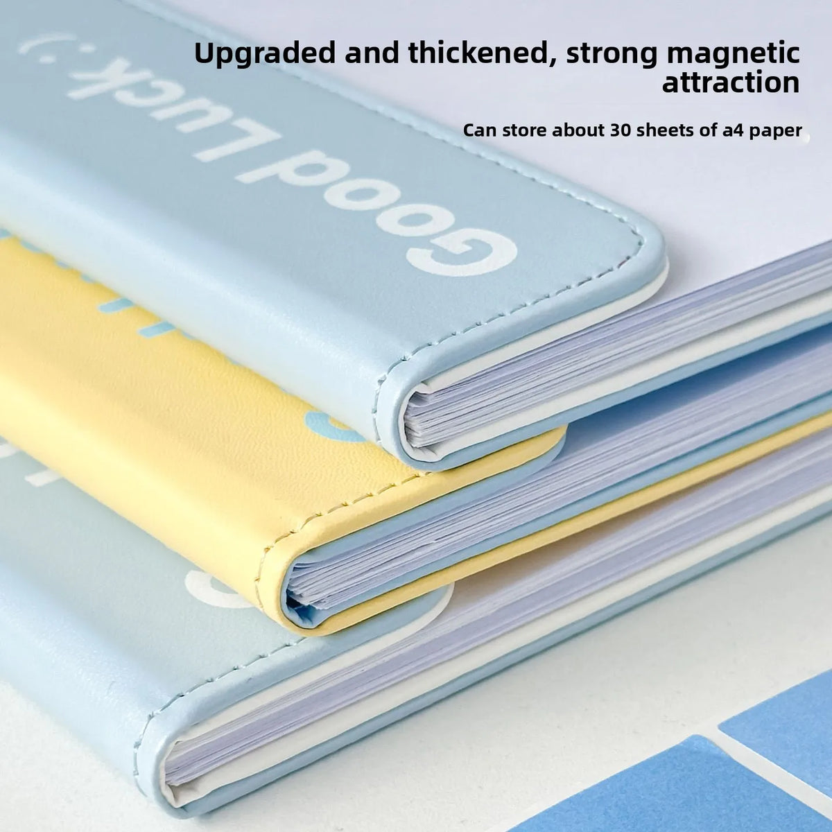 A stack of light blue and yellow A4 leather clipboards demonstrating upgraded magnetic attraction.