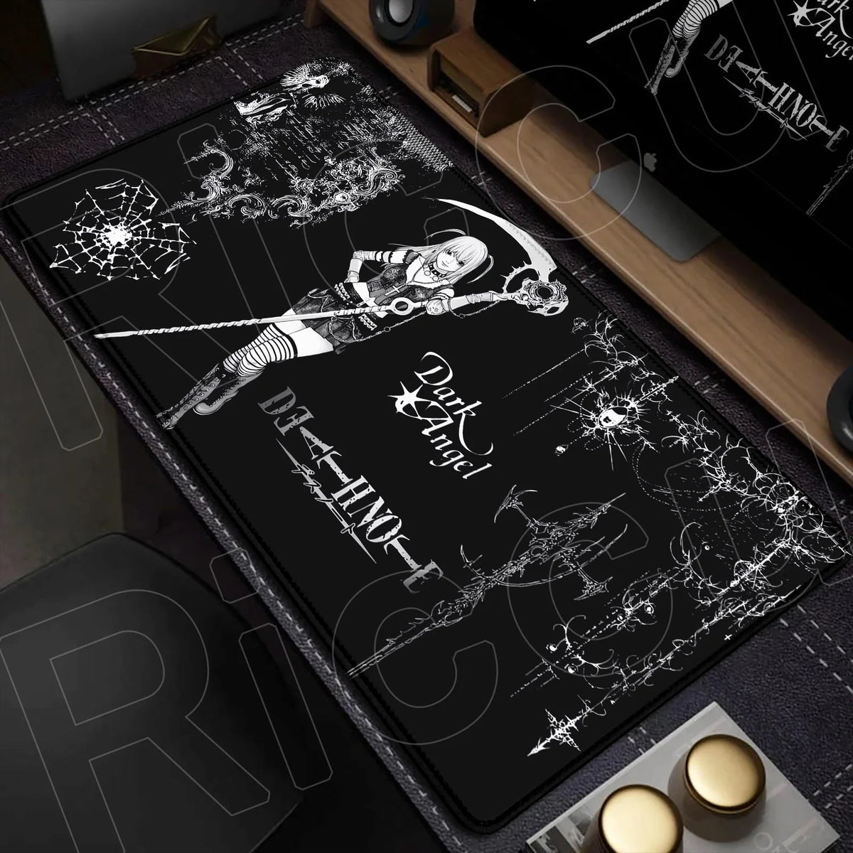 A black mouse pad featuring a white illustration of a figure with a sword and a dark angel design.