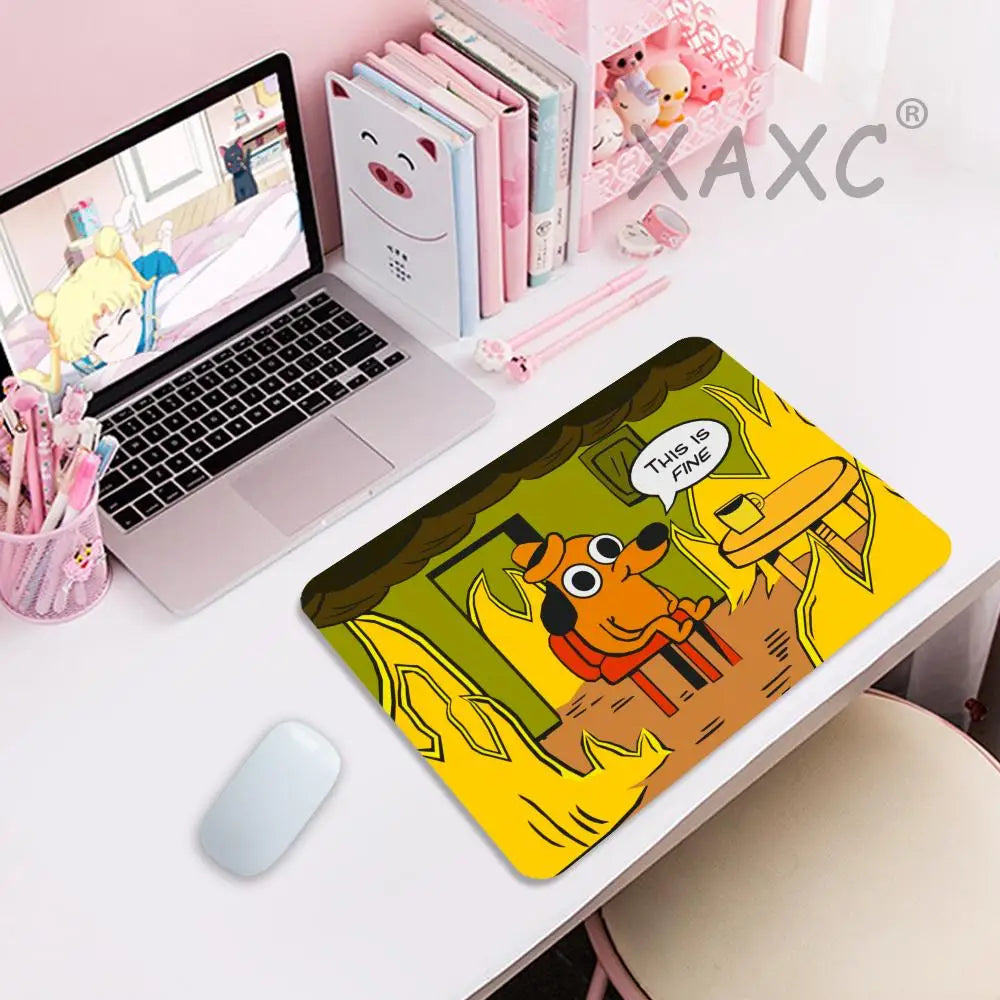 A yellow gaming mouse pad featuring a cartoon dog looking through flames with the text This Is Fine