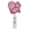 Herzförmiger Glitzer-Acryl-Ausweisclip mit rosa Hintergrund und rotem Stethoskop-Design.