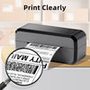 A black thermal shipping label printer is shown printing a mailing label on a wooden surface.
