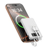 A portable power bank with a digital display is shown next to a smartphone displaying the time 16:34.