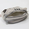 A light gray plush cat pencil case with a zipper opening and multiple zippered compartments.