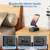 A black wireless speaker with an adjustable phone stand and night light, showing switch button and charging ports.