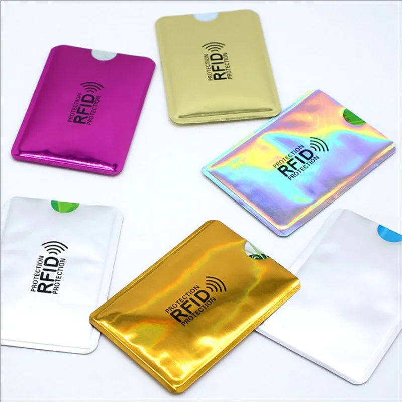 Five different colored aluminum card holders displaying RFID protection features