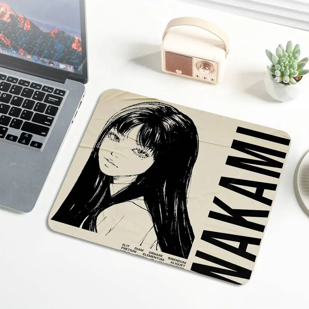 A black and white illustration of a woman with long dark hair on a mouse pad.