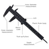 A black plastic ruler used for inner diameter, outer diameter, and depth measurements.