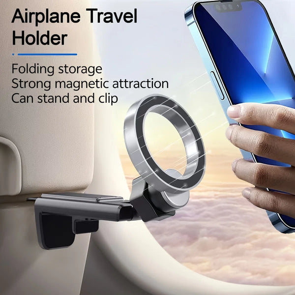 Support magnétique pour avion, fixé à un cadre de fenêtre avec un smartphone à proximité.
