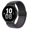 Schwarze Smartwatch mit dunkelgrauem gewebtem Magnetarmband, die 10:08 anzeigt.
