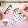 A hand holds a card with cup care instructions written on the back, featuring pink and white designs.
