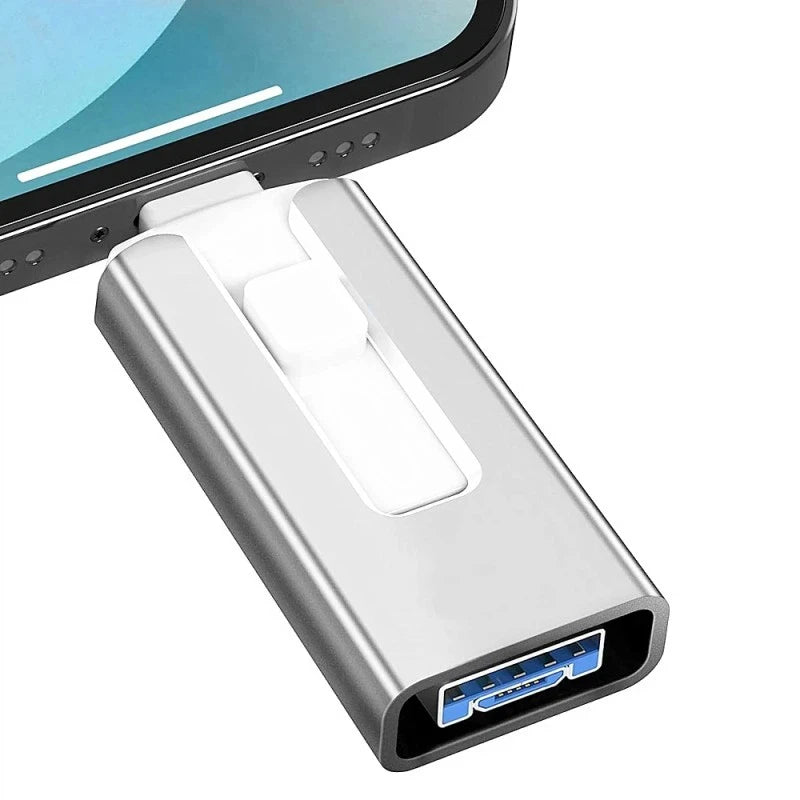 A silver flash drive with a connector for an iPhone, Android, or computer.