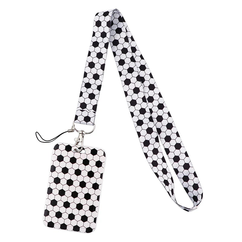 A black and white patterned fabric lanyard with a metal clip for holding ID badges and accessories.