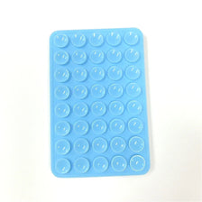 A blue silicone phone mount grip with multiple circular holes for mounting devices.