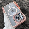A hand holds a pink MagSafe-compatible phone case with a built-in camera bracket and lens cover.