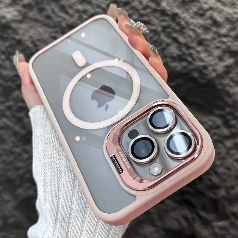A hand holds a pink MagSafe-compatible phone case with a built-in camera bracket and lens cover.