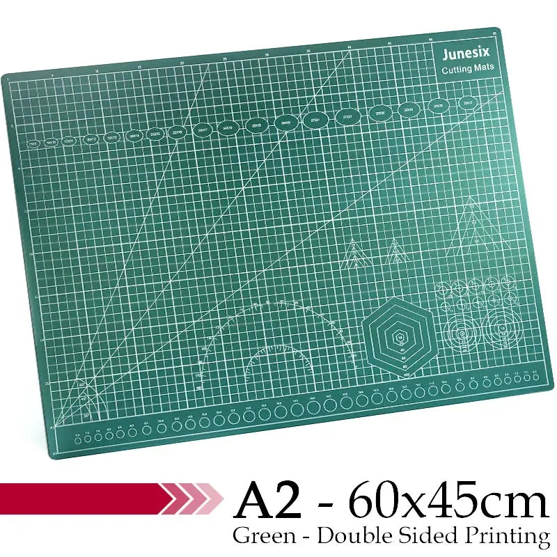 Green A2 cutting mat with grid guides and various geometric patterns for crafting
