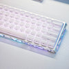 A close-up of a white mechanical keyboard with translucent purple and blue ice crystal keycaps illuminated by RGB lighting.