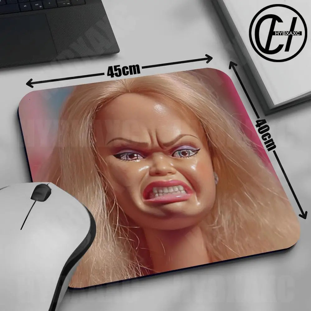 A realistic doll face design printed on a mouse pad with measurements indicating its size.