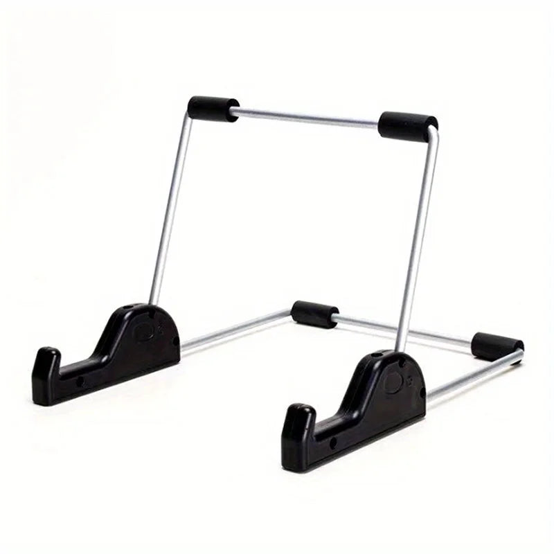 A foldable aluminum stand designed to hold a tablet or laptop.