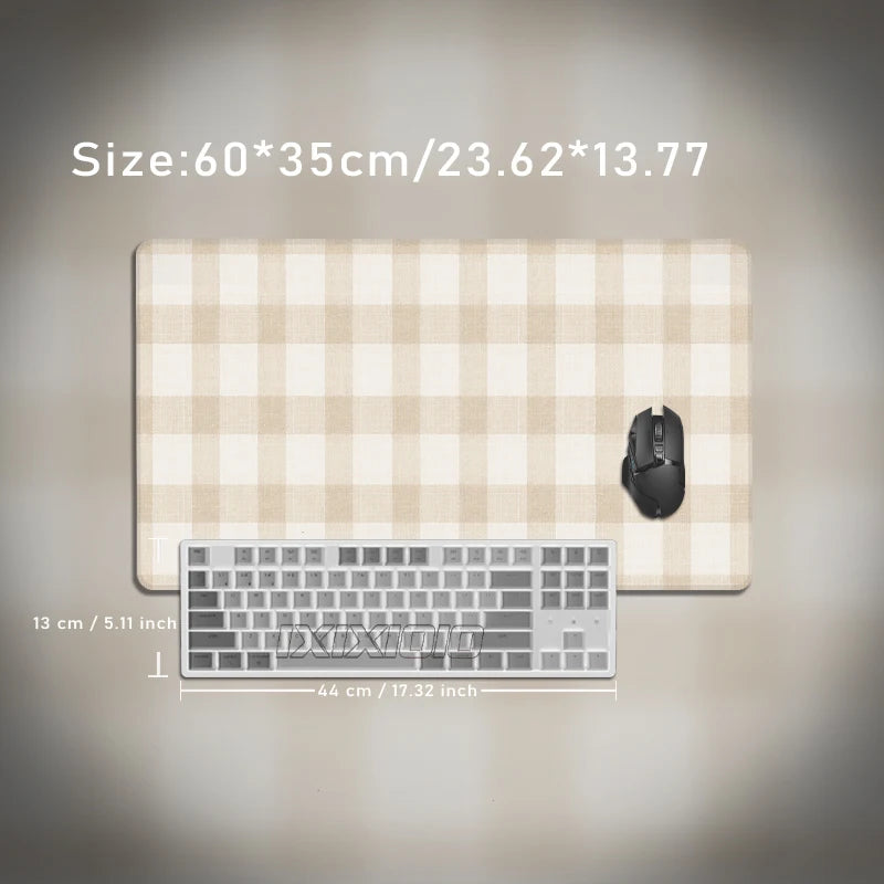 A beige plaid pattern non-slip mouse pad with a silver keyboard placed on top.