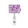 Purple acrylic nurse ID badge holder with text 'Have the day you deserve' and a handprint design.
