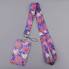 A purple lanyard featuring a pattern of pink and white heart-shaped floral designs.