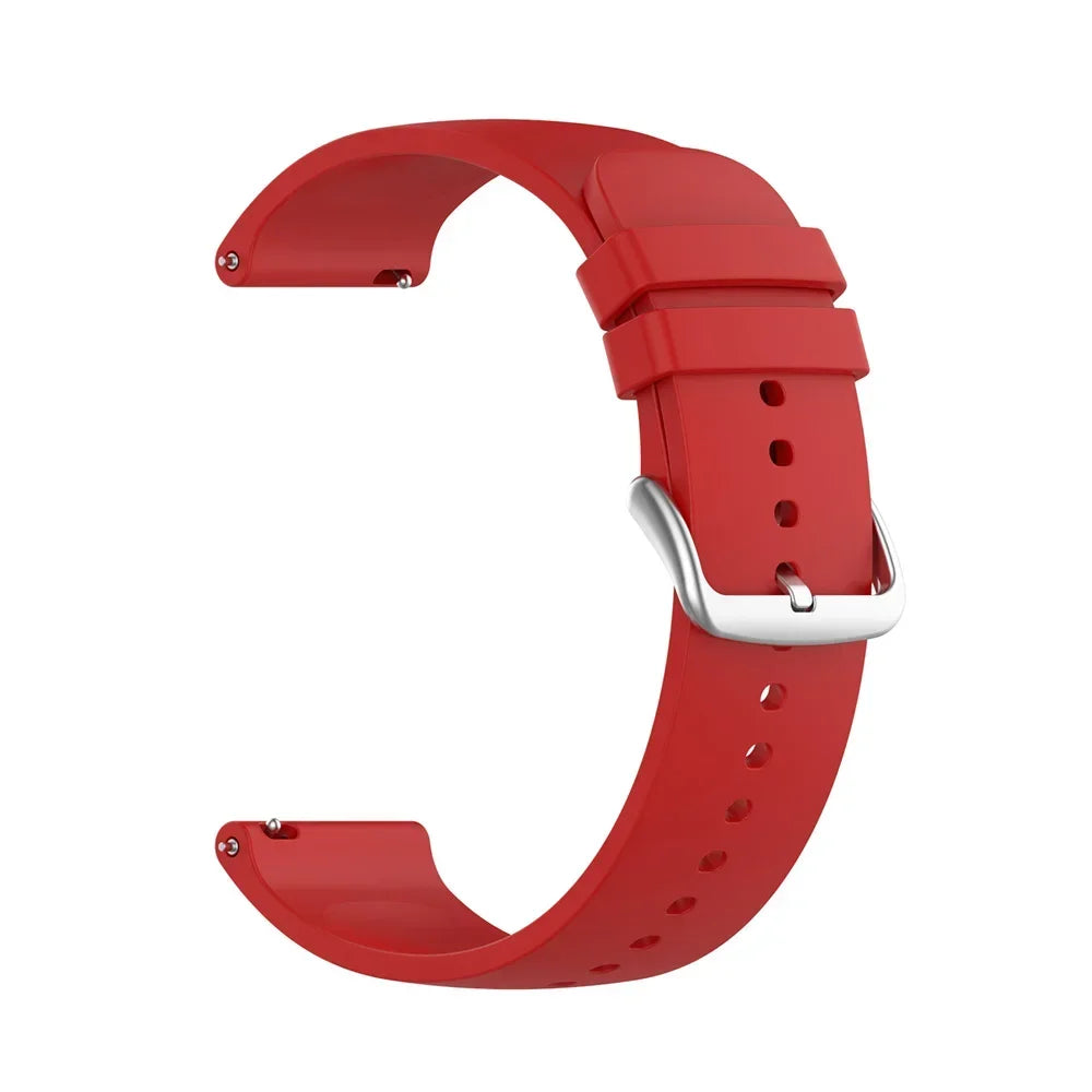 A red silicone watch band with a silver buckle shown in a curved shape.