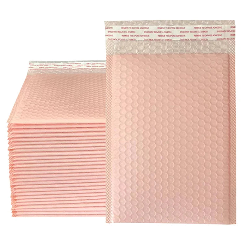 A stack of pink padded bubble mailers with self-seal closures is shown.