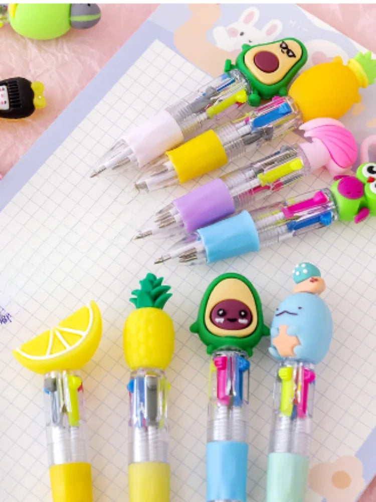 A collection of cute cartoon mini ballpoint pens in various colors including yellow, green, pink, and blue.