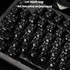 Close-up view of black carbon fiber texture keycaps on an MX mechanical keyboard.