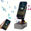 A wireless speaker with an adjustable phone stand and night light is shown next to musical notes.