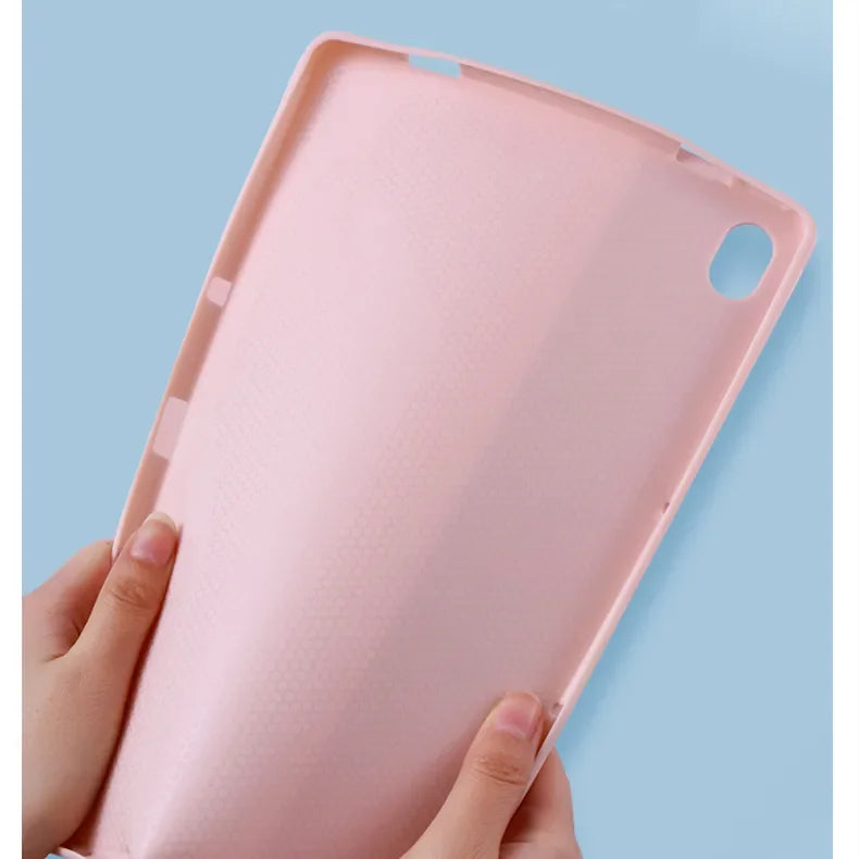 A hand holds a pink Rainbow Backlit Keyboard Case for an Honor Pad, showing the tablet case design.