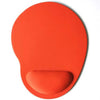 An orange ergonomic mouse pad with a contoured shape and wrist support.