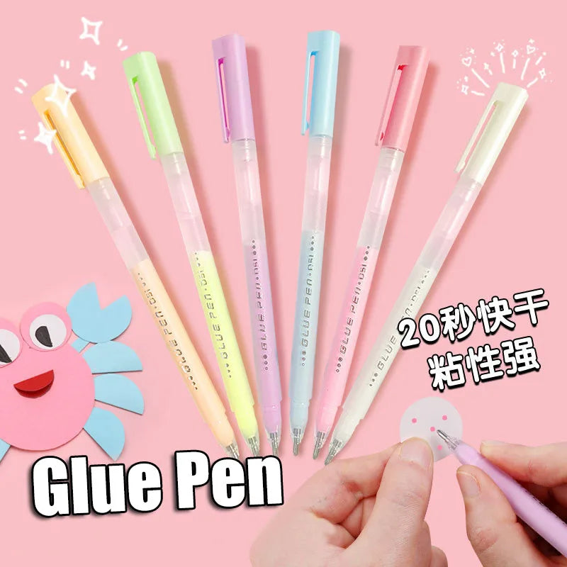A collection of colorful glue pens in various shades including yellow, pink, and blue, shown being held by a hand.