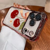 A clear iPhone case with a cherry blossom pattern and an electroplated finish is being held by a person.