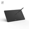 A black digital drawing tablet with a stylus resting on its surface.