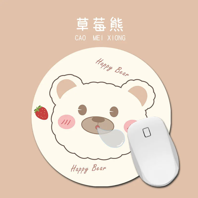 A round mouse pad featuring a cute bear design with a strawberry and the text Happy Bear.