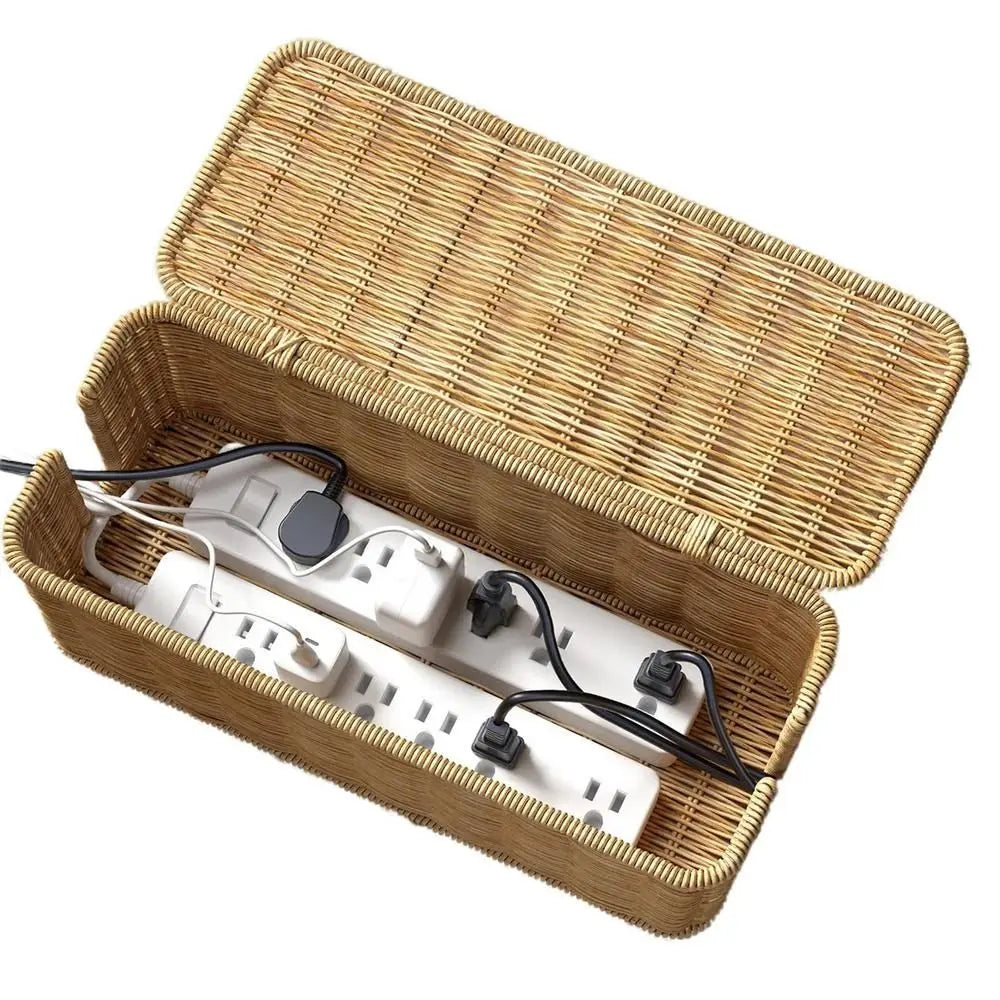 Handwoven rattan cable management box with a lid containing white electrical cords and plugs